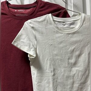 Two (2) TNA TNAction workout t-shirts - Small- never worn